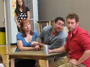 Part of the cast rehearses a scene from "Les Mis."